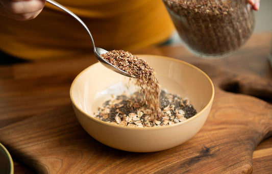 Menopausal woman with bowl of health seeds